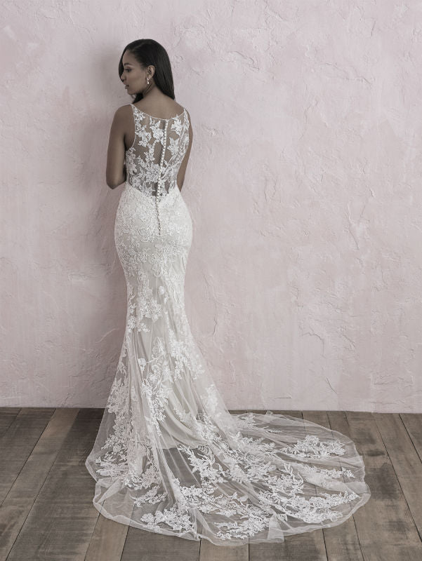 Elegant lace wedding dress with a fitted silhouette, featuring a deep V-neckline and intricate floral detailing, perfect for a bride seeking timeless beauty and sophistication.