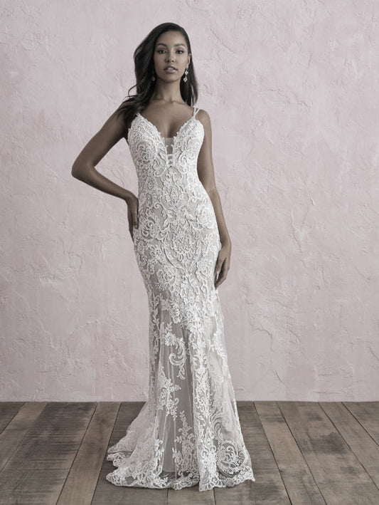 Sleek and sophisticated lace wedding dress with a deep V-neckline and intricate detailing, designed to highlight your figure with elegance and style.