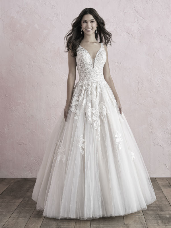 Elegant A-line wedding dress with deep V-neckline, floral lace appliqués, and a flowing tulle skirt, perfect for brides seeking a romantic and timeless look.