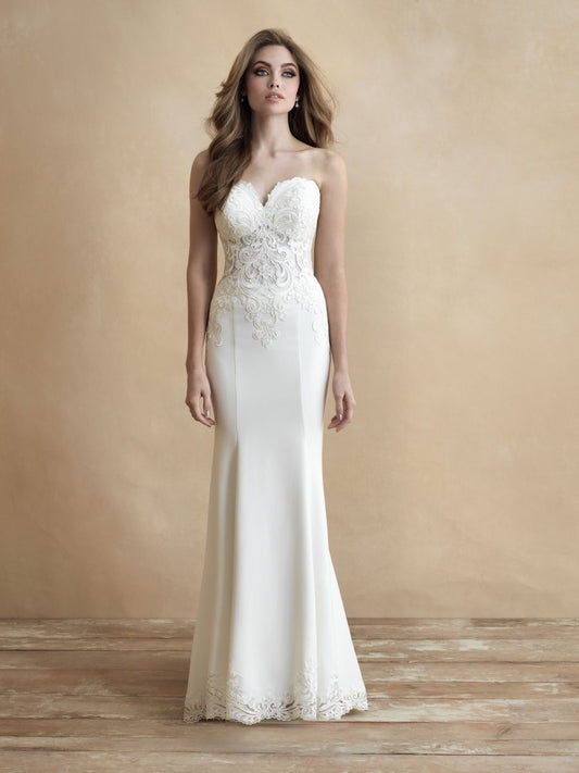 Sleek strapless wedding gown with intricate lace bodice and subtle train. Perfect for brides seeking timeless elegance and a modern silhouette.