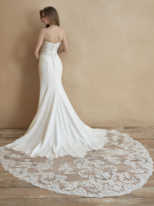 Sleek strapless wedding gown with intricate lace bodice and subtle train. Perfect for brides seeking timeless elegance and a modern silhouette.