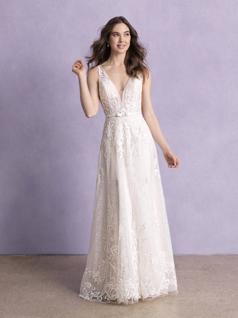 Front view of a romantic lace wedding dress with a deep V-neckline, intricate floral patterns, and a flowing A-line skirt, perfect for a timeless bridal look.