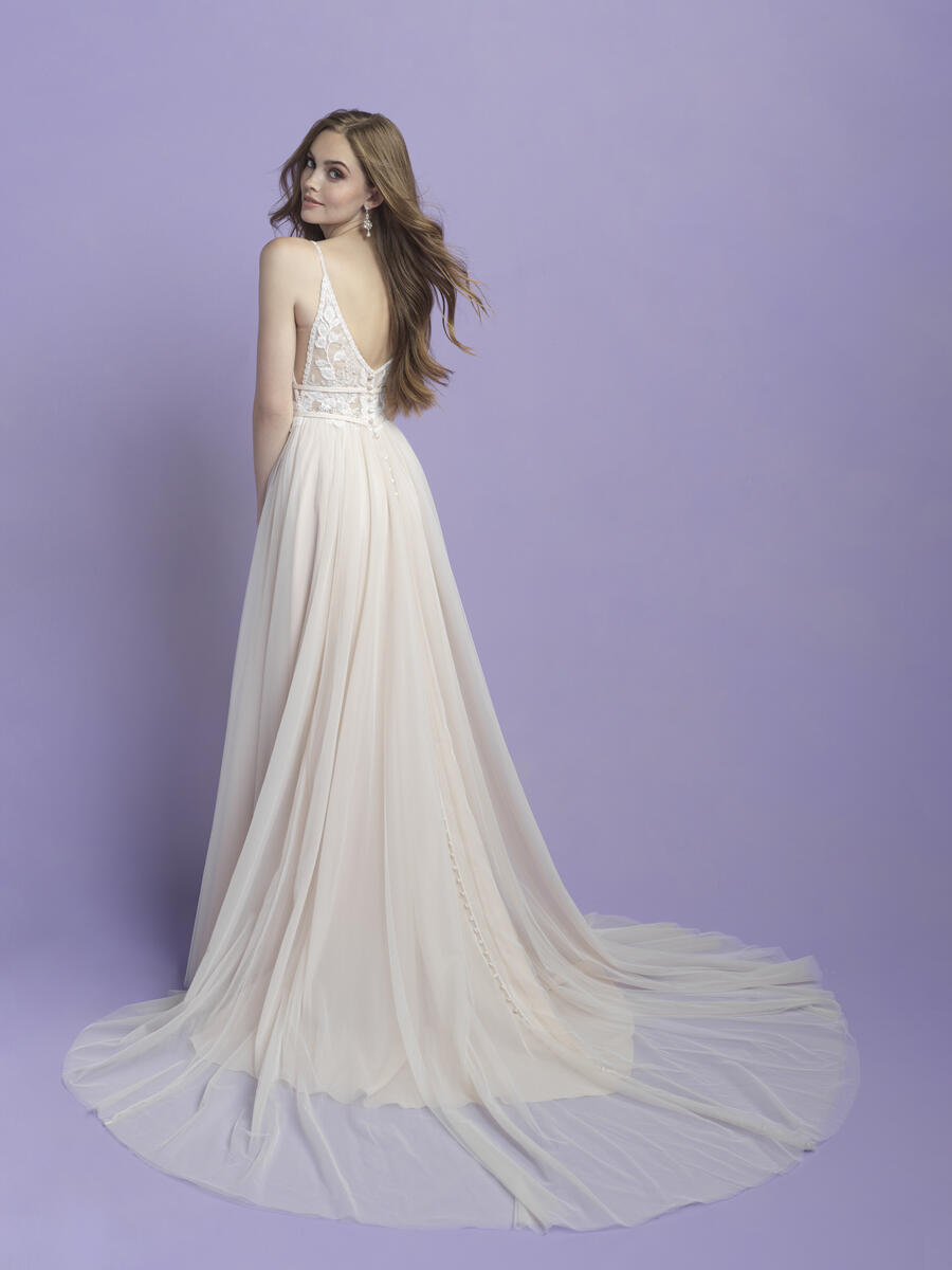 Chic A-line wedding dress with a plunging V-neck, lace bodice, and soft tulle skirt, creating an effortlessly romantic bridal style.