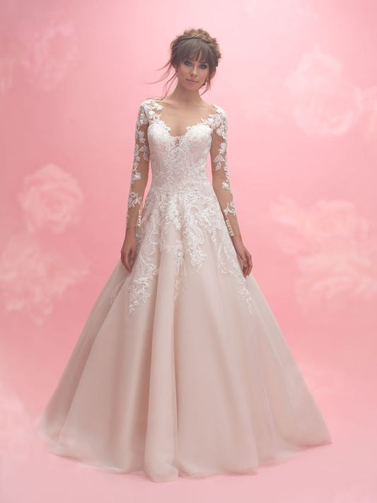 Elegant A-line wedding dress with illusion lace sleeves and a sweetheart neckline, featuring intricate floral appliqués and a flowing skirt. Ideal for brides desiring a romantic and timeless look.