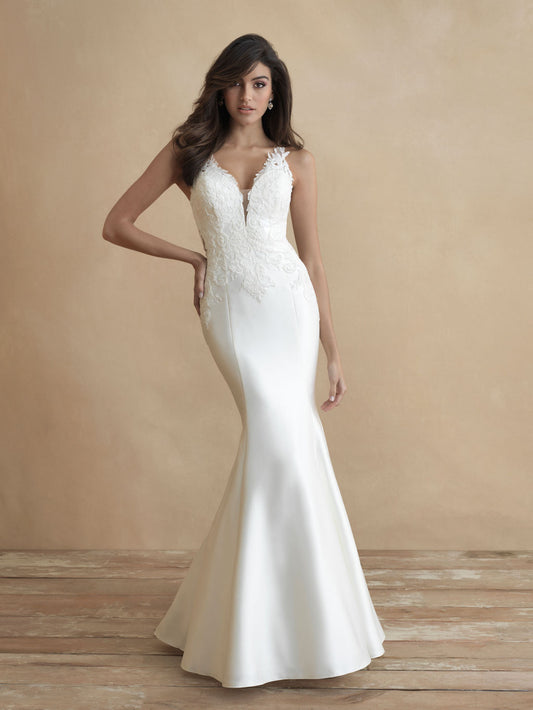 Sleek mermaid wedding dress with lace bodice, plunging V-neckline, and fitted silhouette. Perfect for modern brides seeking a sophisticated and figure-flattering bridal gown.