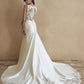 Sleek mermaid wedding dress with lace bodice, plunging V-neckline, and fitted silhouette. Perfect for modern brides seeking a sophisticated and figure-flattering bridal gown.