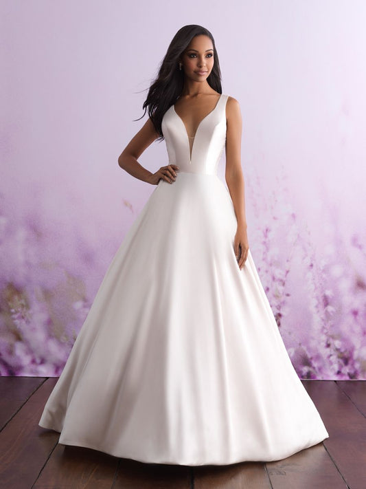 Modern satin ball gown with a deep V-neckline and structured bodice, offering a sleek and sophisticated bridal look. Perfect for the contemporary bride seeking understated elegance.