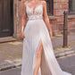 Modern wedding gown featuring a plunging lace bodice, thin straps, and a flowing skirt with a thigh-high slit, perfect for the bride seeking a blend of elegance and contemporary flair.