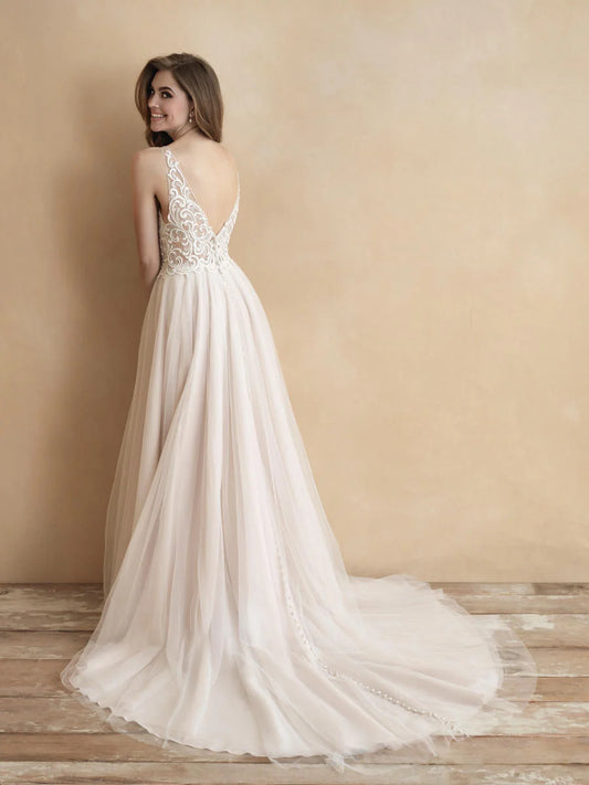 Chic A-line wedding dress featuring a delicate lace bodice, deep V-neckline, and flowing tulle skirt. Ideal for brides seeking an elegant and effortless bridal look.