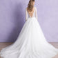 Step into timeless beauty with this lace long-sleeve bridal gown, featuring a plunging neckline and a full tulle skirt. Perfect for the bride seeking elegance and sophistication on her wedding day.