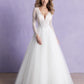 Step into timeless beauty with this lace long-sleeve bridal gown, featuring a plunging neckline and a full tulle skirt. Perfect for the bride seeking elegance and sophistication on her wedding day.
