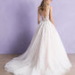 Stunning bridal gown with a deep V-neckline, delicate lace bodice, and a full tulle skirt, designed for the bride seeking a classic yet modern look on her special day.